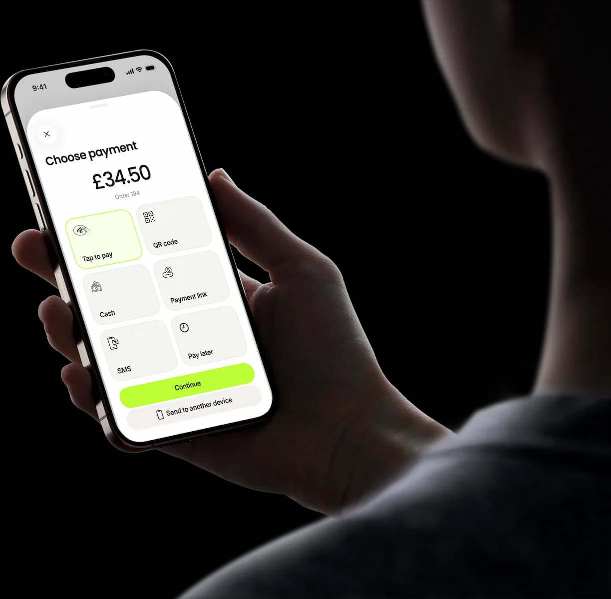 A hand holds a phone showing Tapp’s “Choose payment” screen for an order